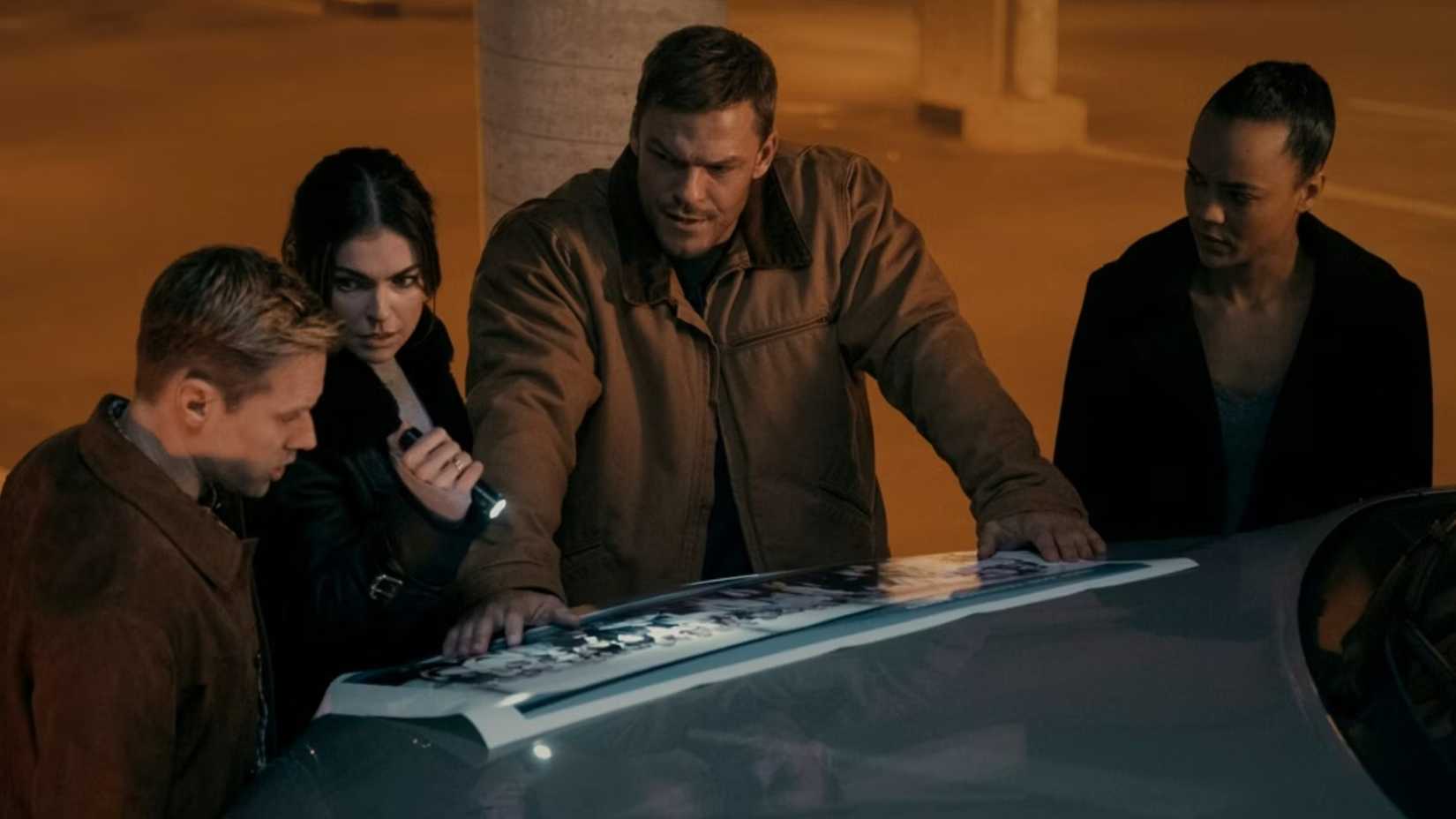 Alan Ritchson as Jack Reacher, Serinda Swan as Karla Dixon, Shaun Sipos as David O'Donnell, and Maria Sten as Frances Neagley in Reacher Season 2