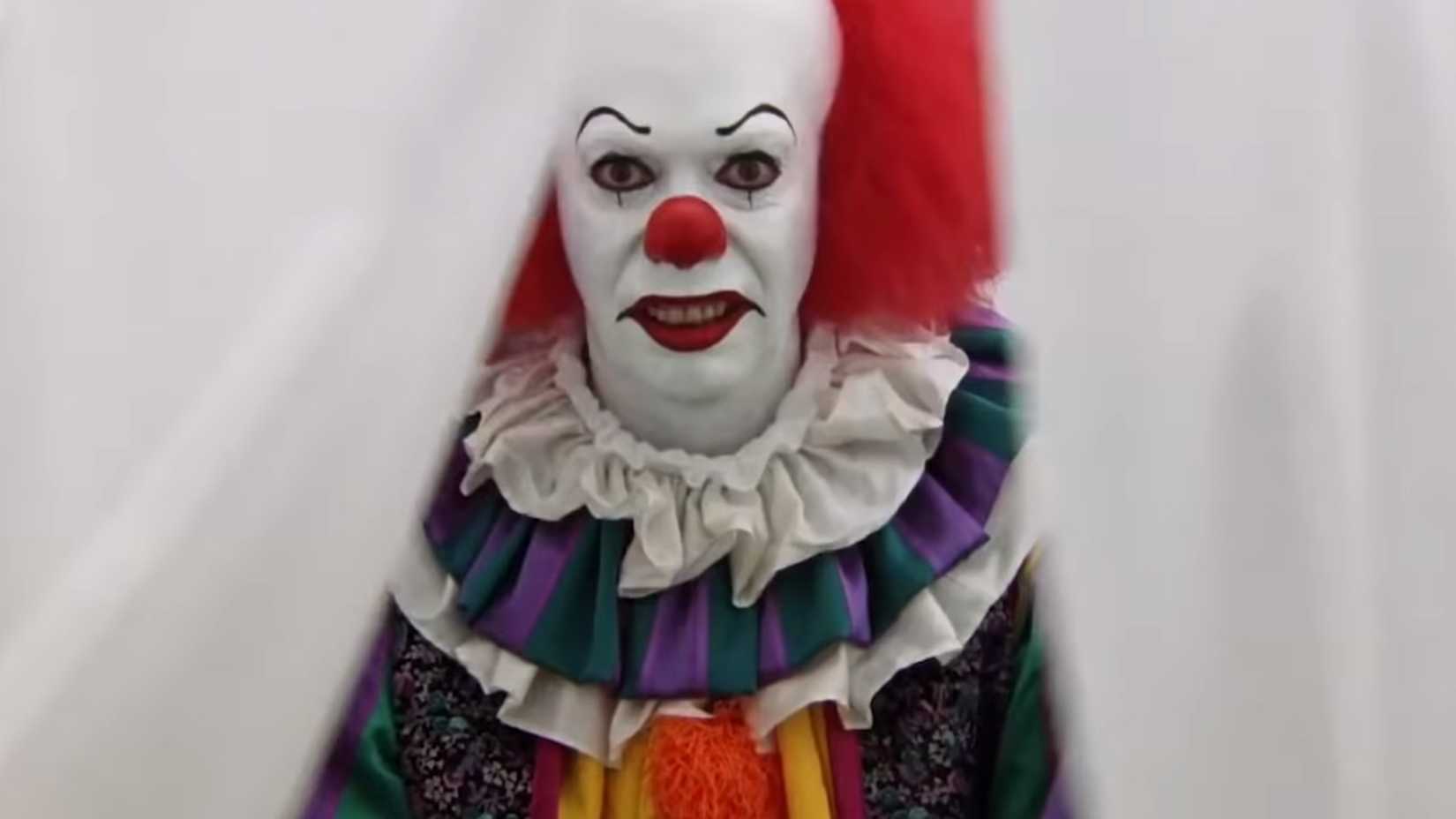 Tim Curry as Pennywise in IT