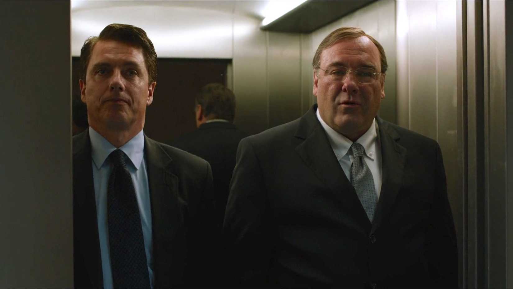 Two men stand in an elevator in Zero Dark Thirty