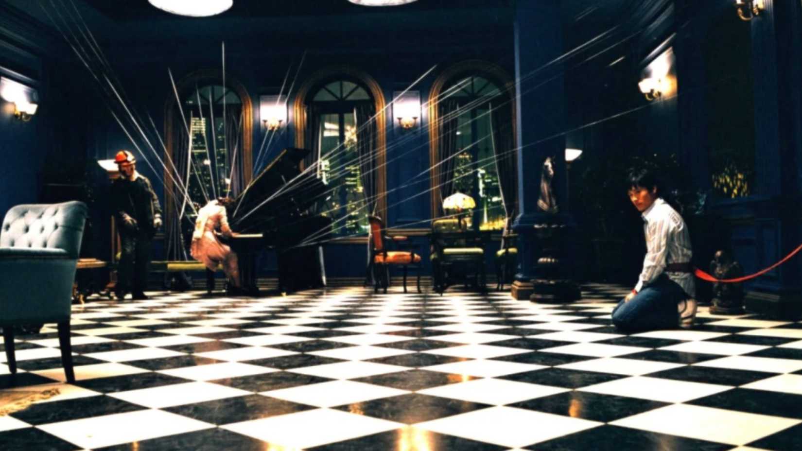 a man is attached to wire while a woman is wired to a piano in the film three... extremes