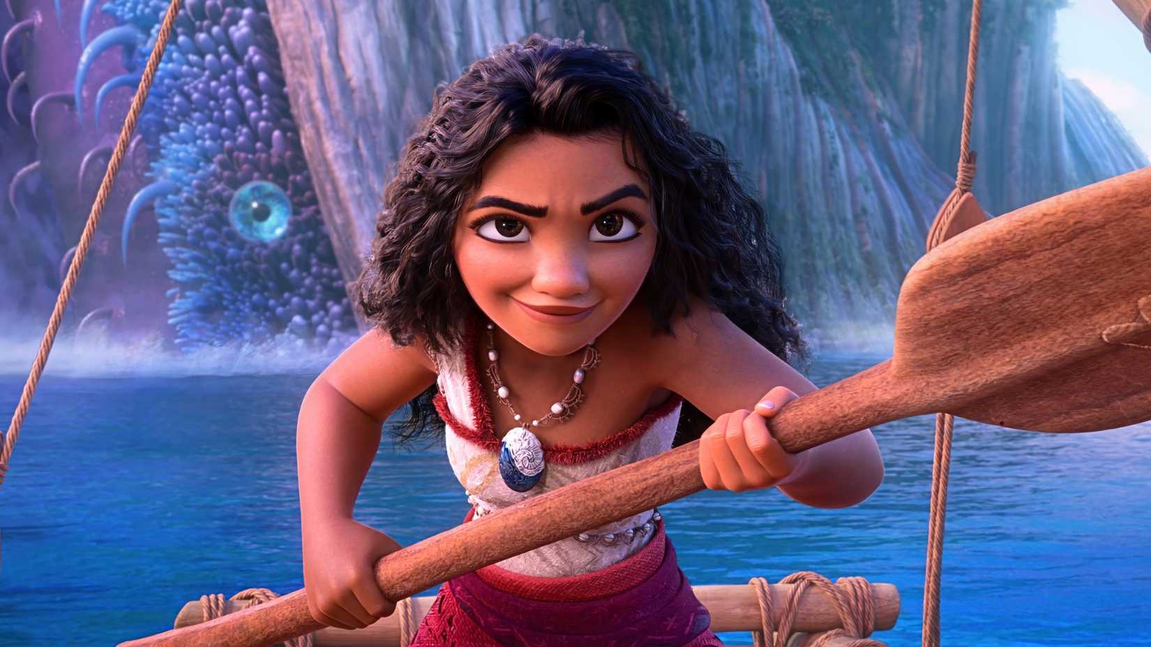 Aulii Cravalho as Moana with a paddle in Moana 2