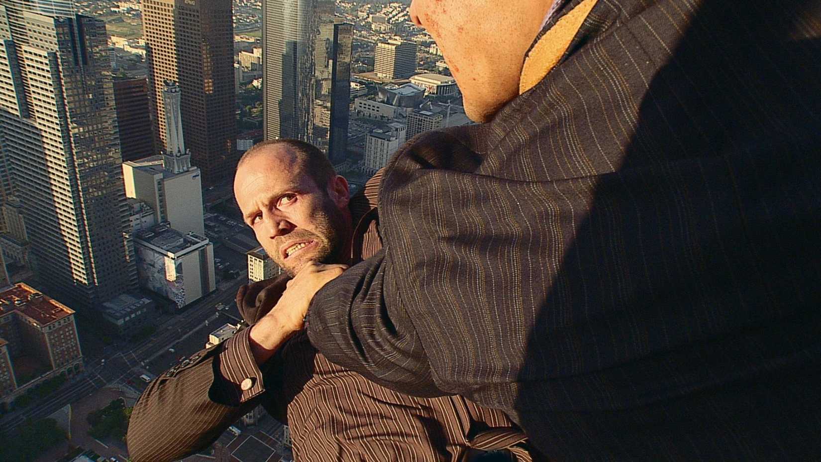 Jason Statham dangles over an edge in Crank