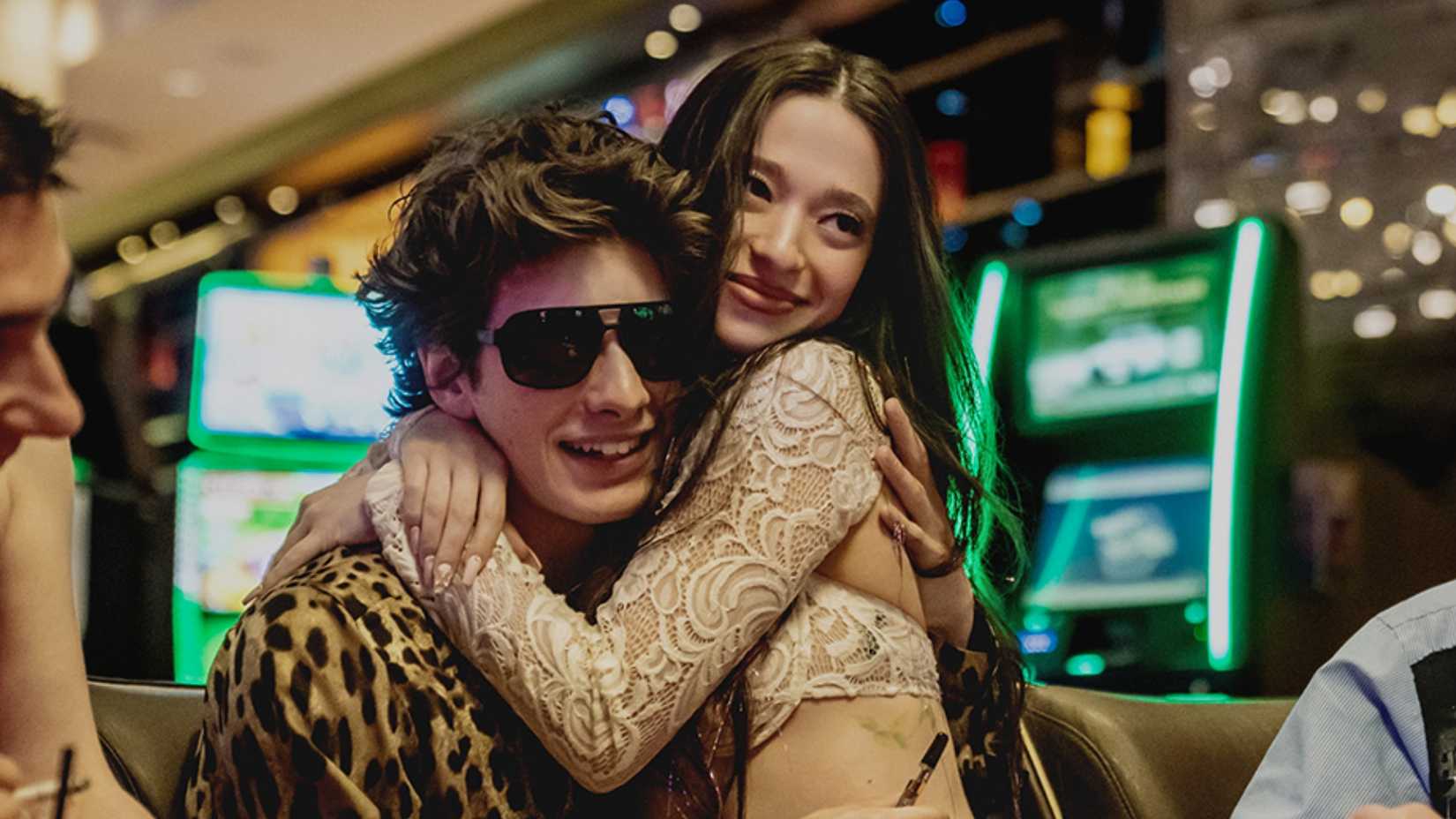 Mikey Madison and Mark Eidelstein hugging in Anora