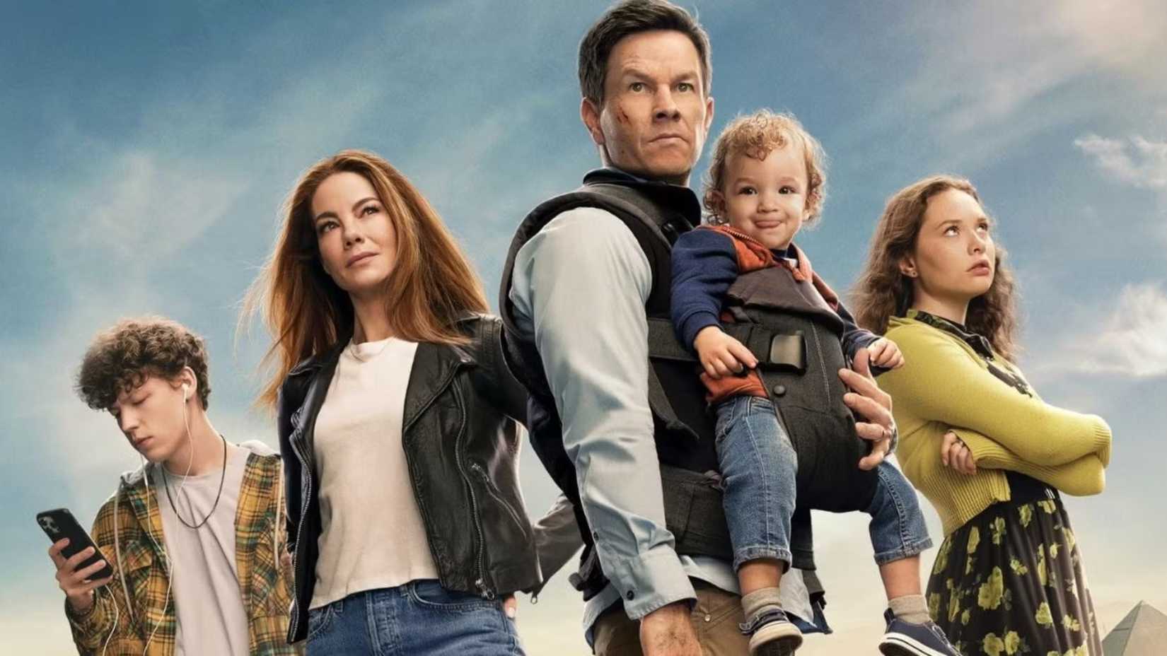 Mark Wahlberg, Michelle Monaghan, Van Crosby and Zoe Colletti look ready for action in The Family Plan poster