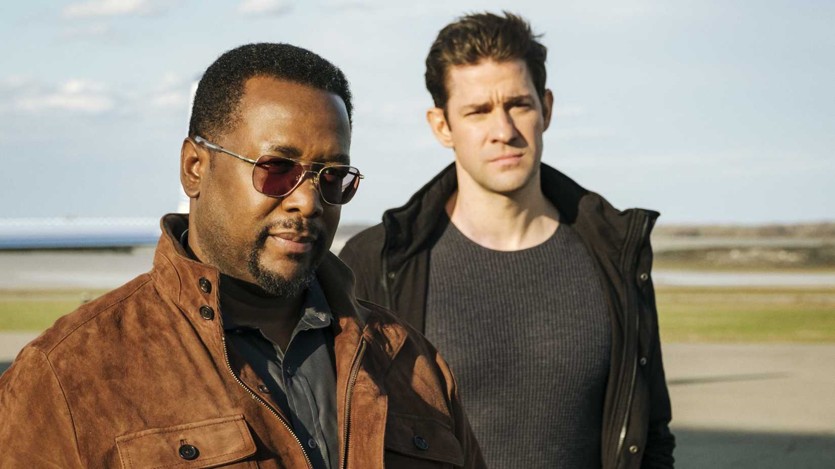 James and Jack stand on a runway in Jack Ryan