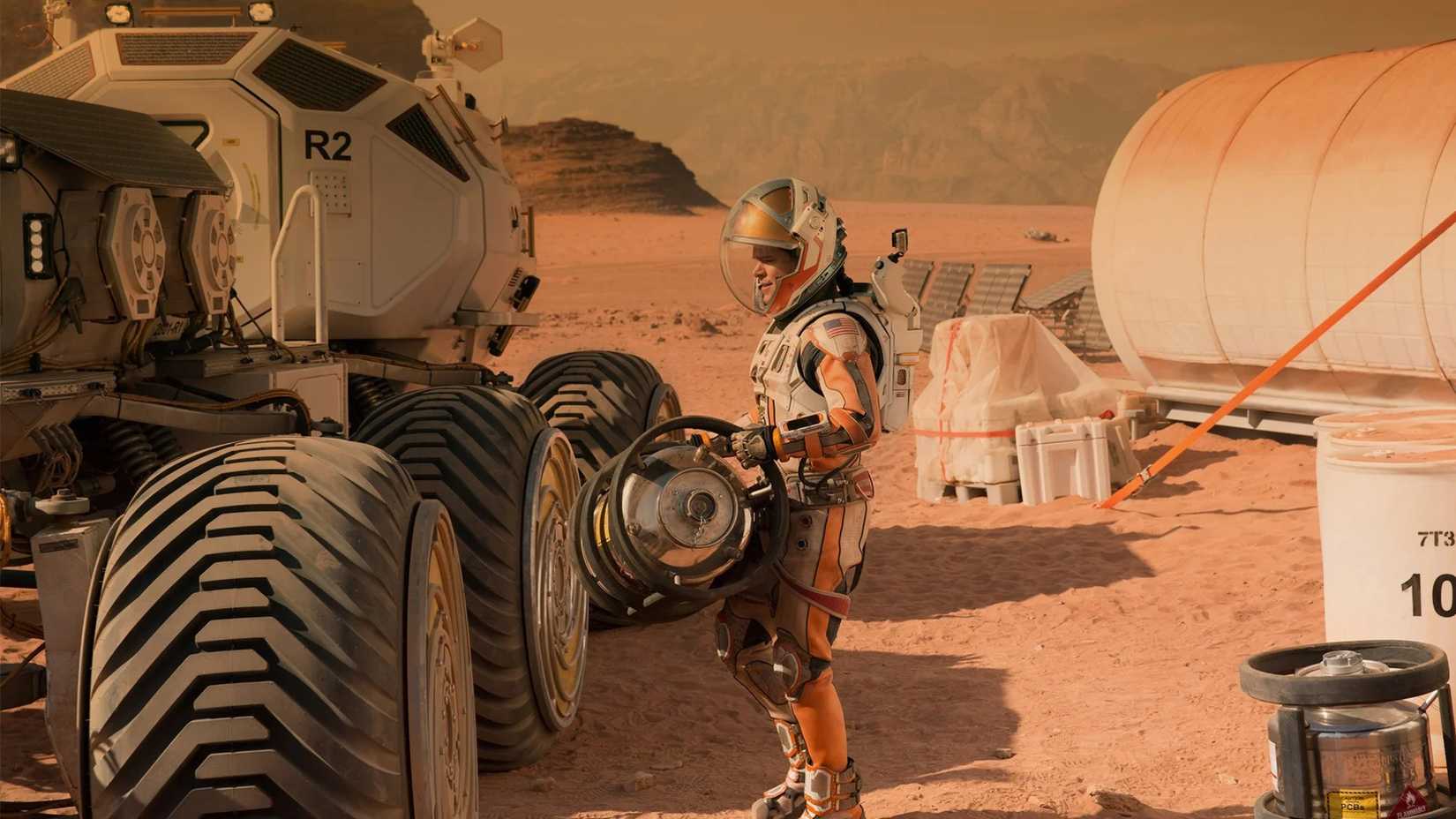 Matt Damon standing next to a rover in The Martian, which Niomi Scott was cut from.