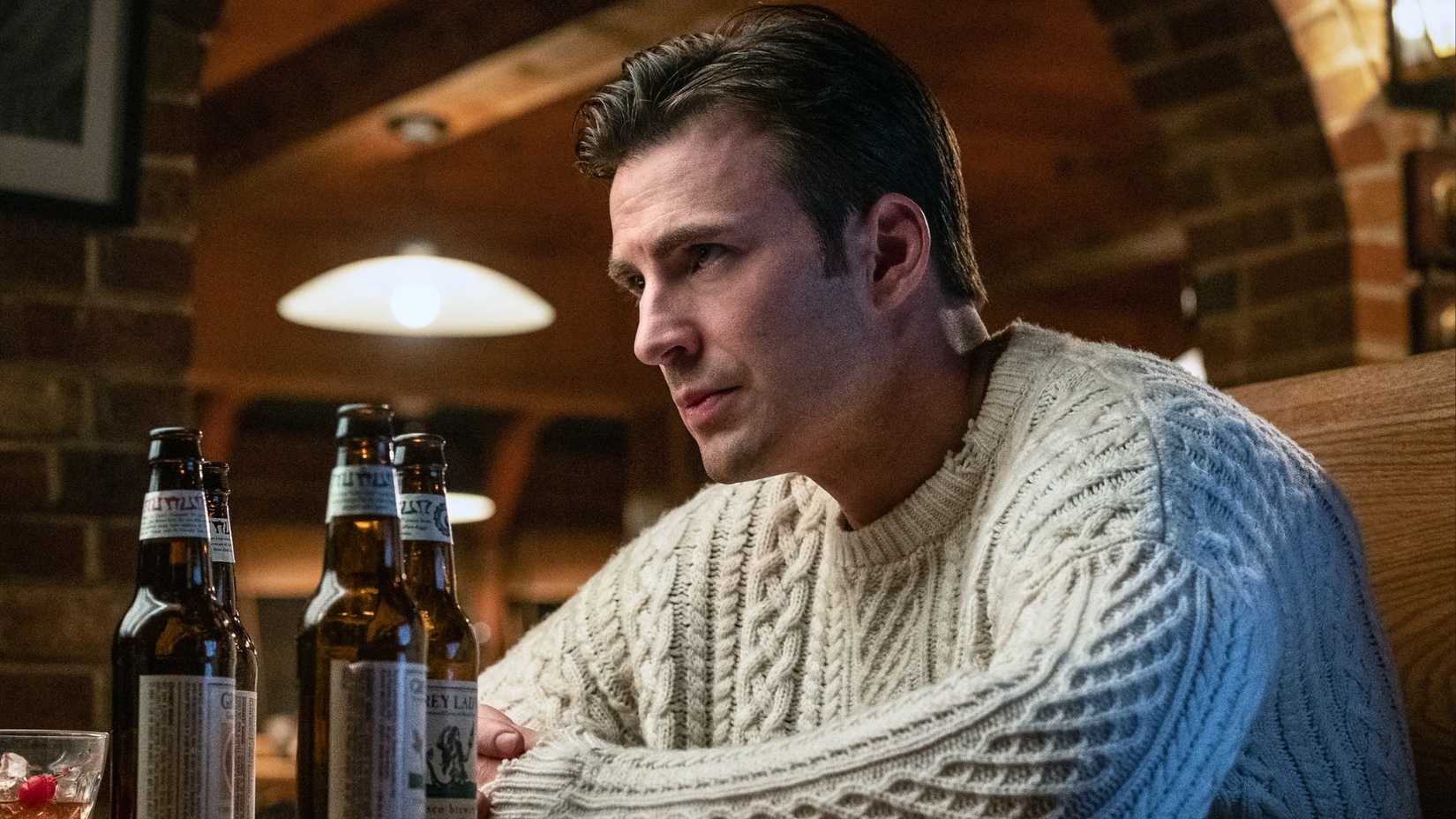 Chris Evans sitting as Ransom in Knives Out