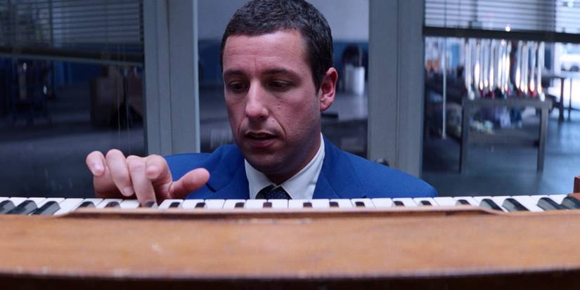 Adam Sandler as Barry at a keyboard in the romantic comedy film Punch-Drunk Love