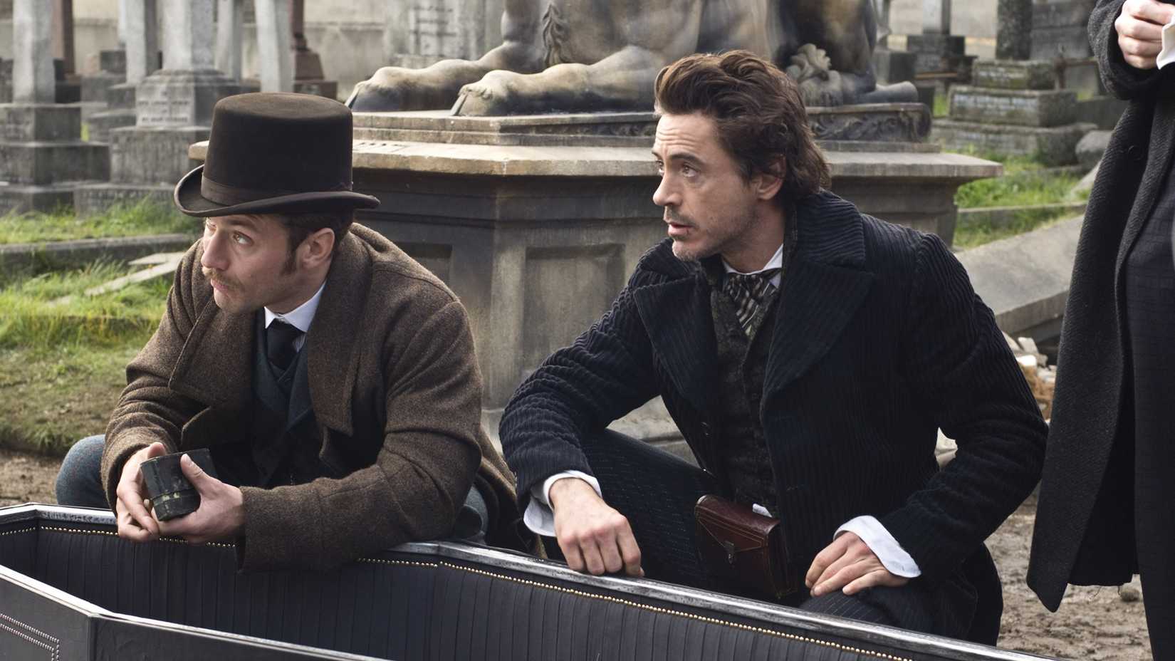 Robert Downey Jr. and Jude Law as Sherlock Holmes and Watson