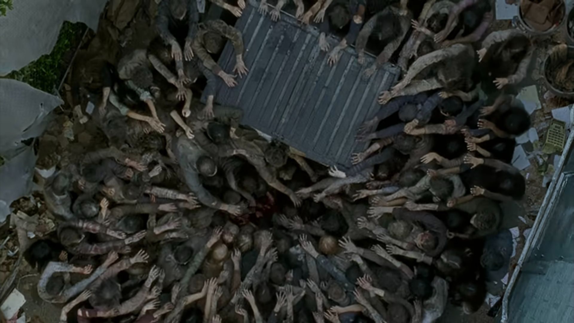 Glenn under the zombies in The Walking Dead episode Thank You.