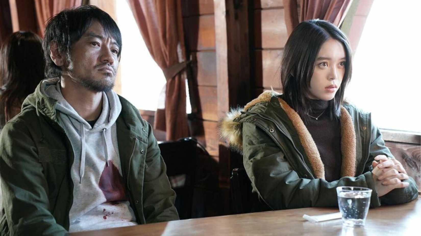 Akari Takaishi sits at a table with a ghost in Ghost Killer (2024)