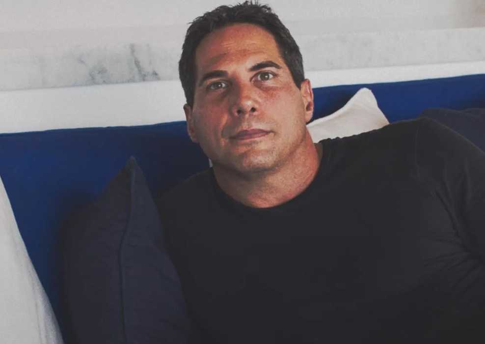 Girls Gone Wild founder Joe Francis sits on a couch