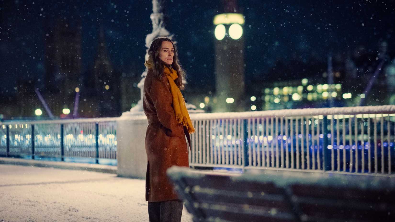 Keira Knightley standing outside in the snow in Black Doves