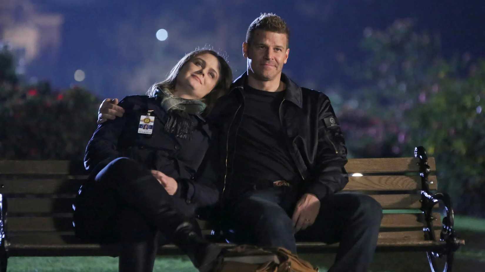 Bones and Booth sit on a bench in Bones