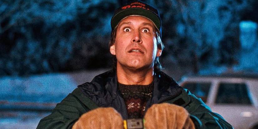 Chevy Chase plugs in lights outside in National Lampoon's Christmas Vacation