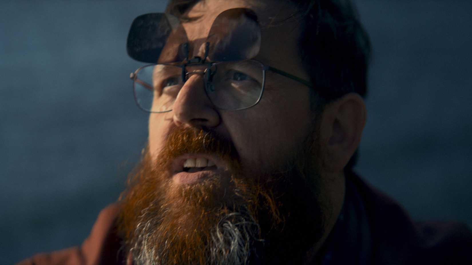 Nick Frost with his sunglasses up in the 2024 movie Get Away