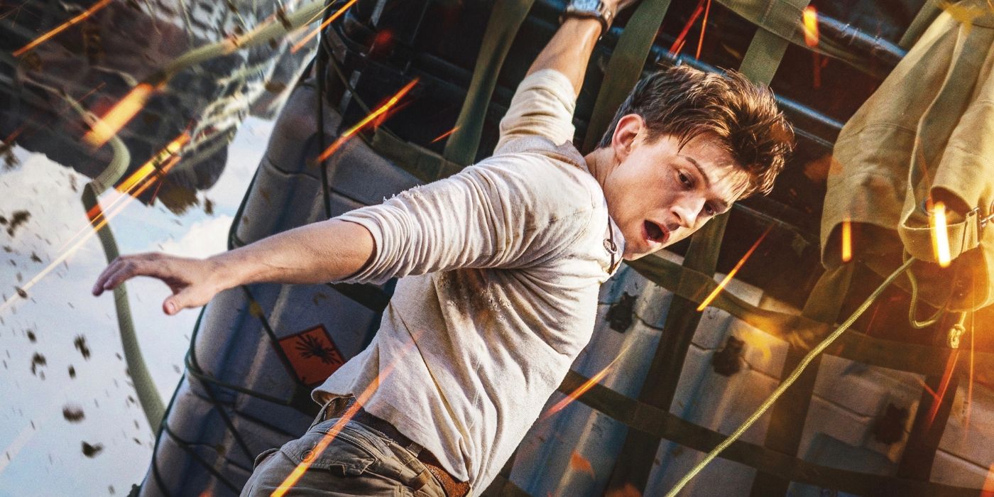 Tom Holland hanging off carge in Uncharted