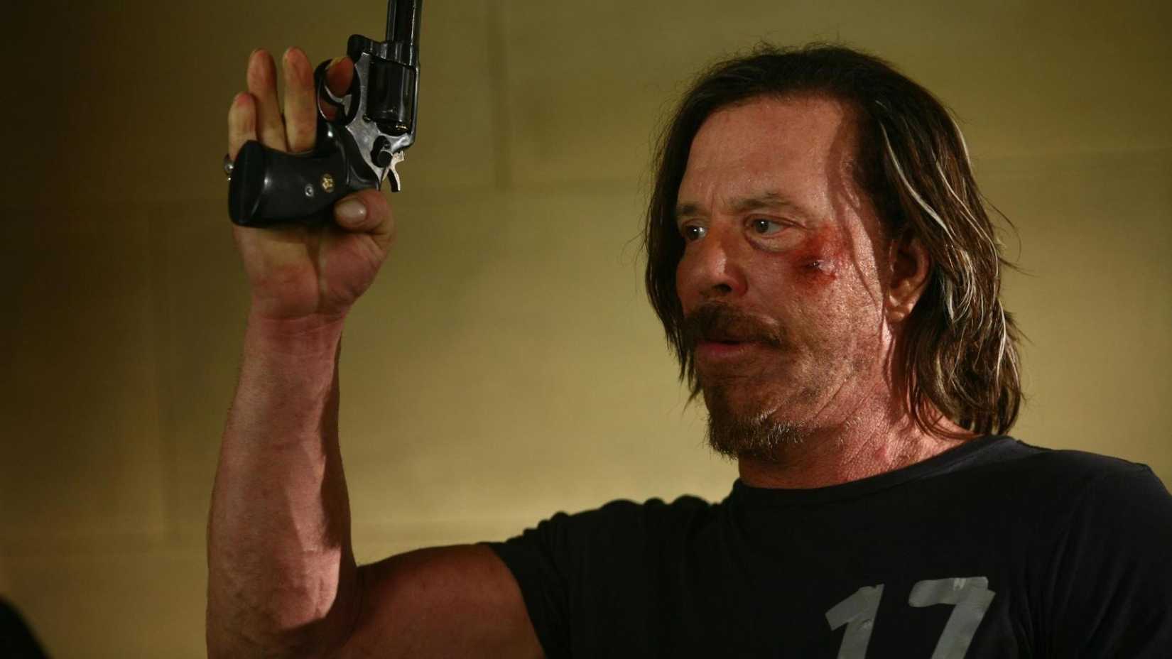Mickey Rourke holding a gun in the thriller 13 (2010)
