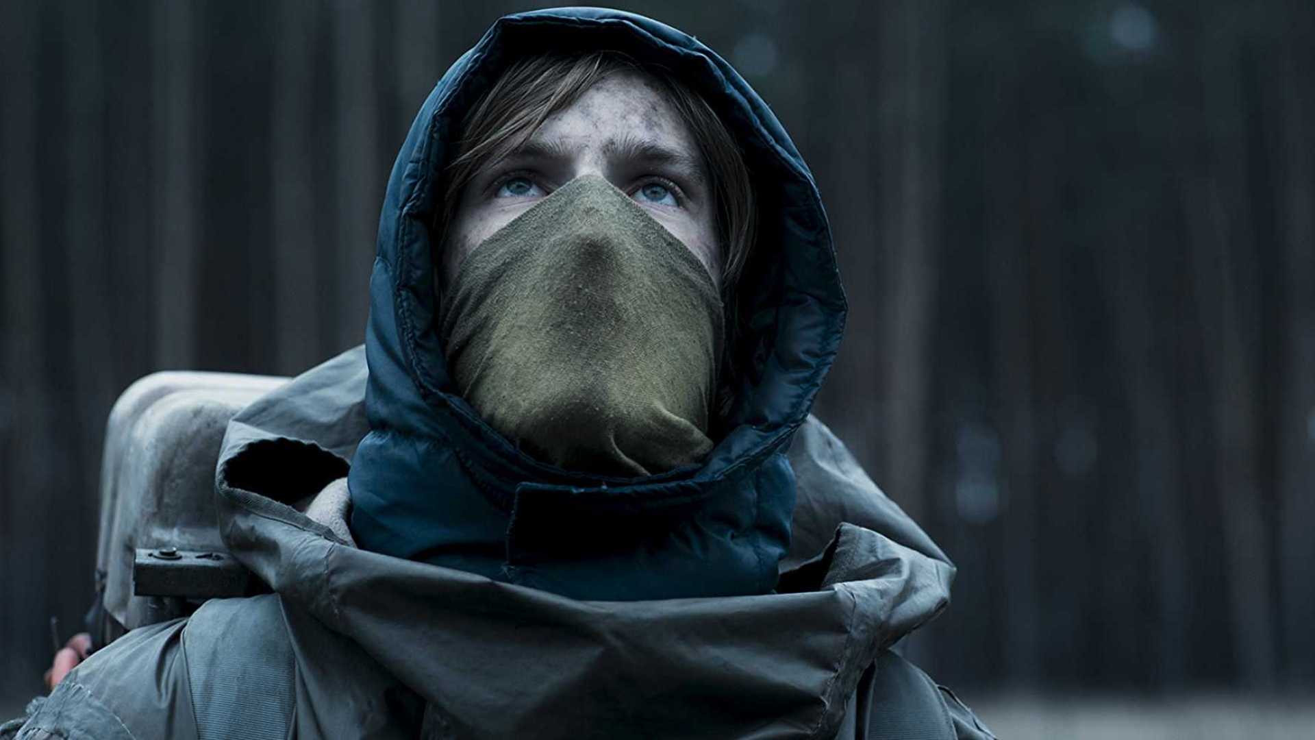 A man in a hood and mask in Dark
