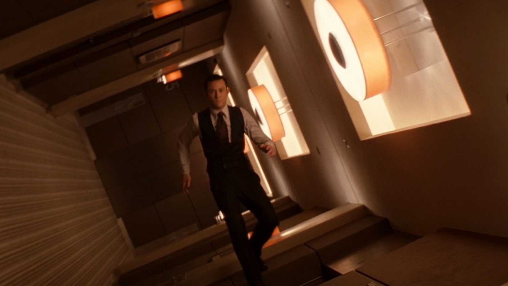 Joseph Gordon-Levitt in Inception running through a hallway