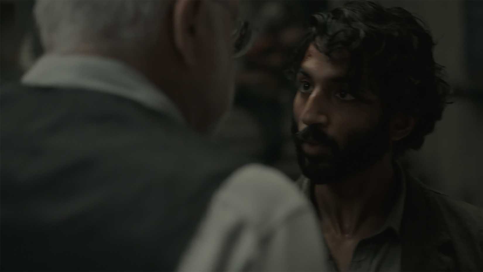 Lukas talking to Bernard quietly in Silo.