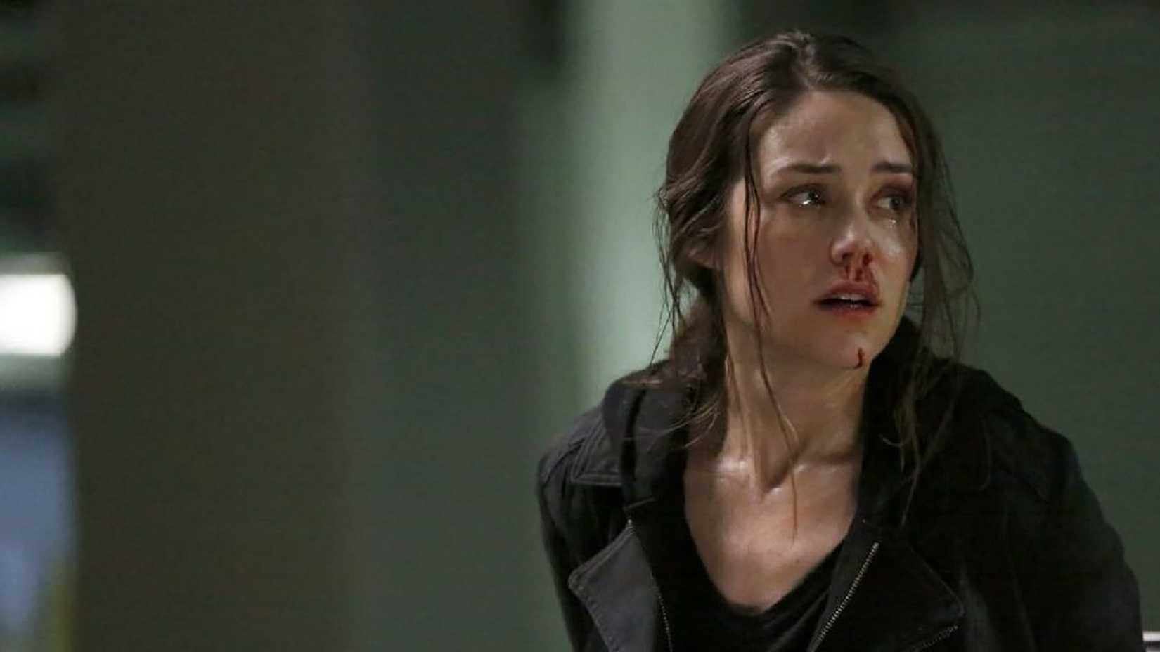 Liz with her hair up looking frantic, blood coming from her nose on The Blacklist.