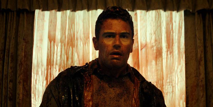 Theo James in The Monkey with blood all over his face