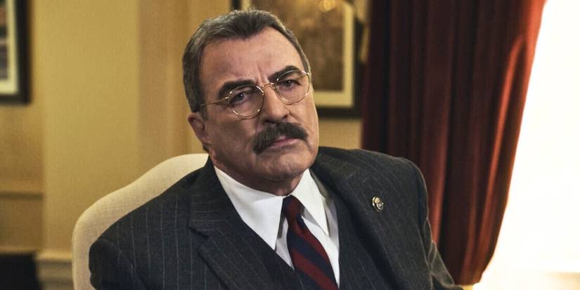 Tom Selleck in Blue Bloods Season 13 sitting at his desk