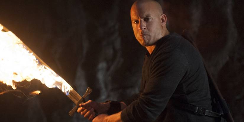 Vin Diesel in The Last Witch Hunter holding a flaming sword