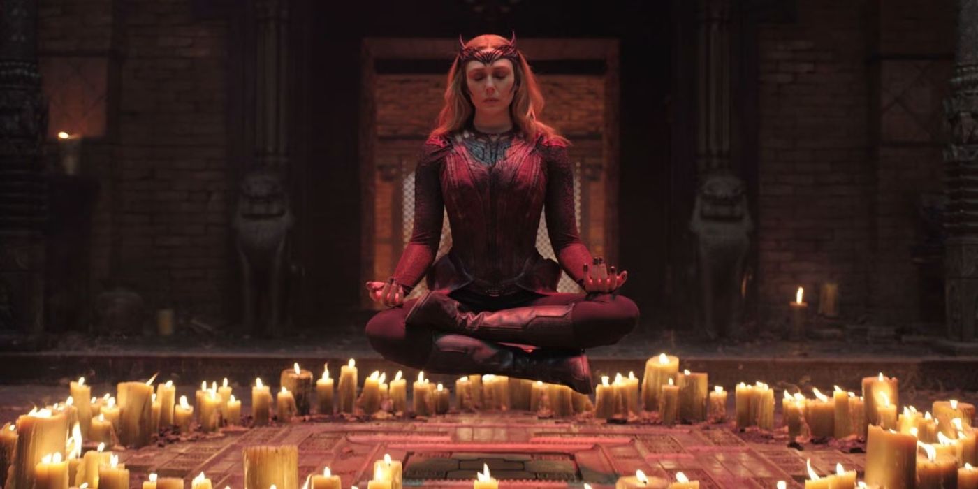 Elizabeth Olsen floats above candles as Scarlet Witch in Doctor Strange in the Multiverse of Madness