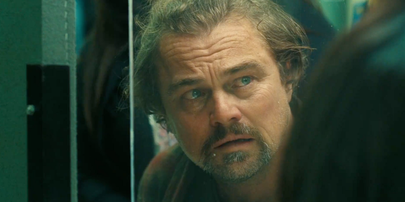 Leonardo DiCaprio in One Battle After Another looking at someone off-screen