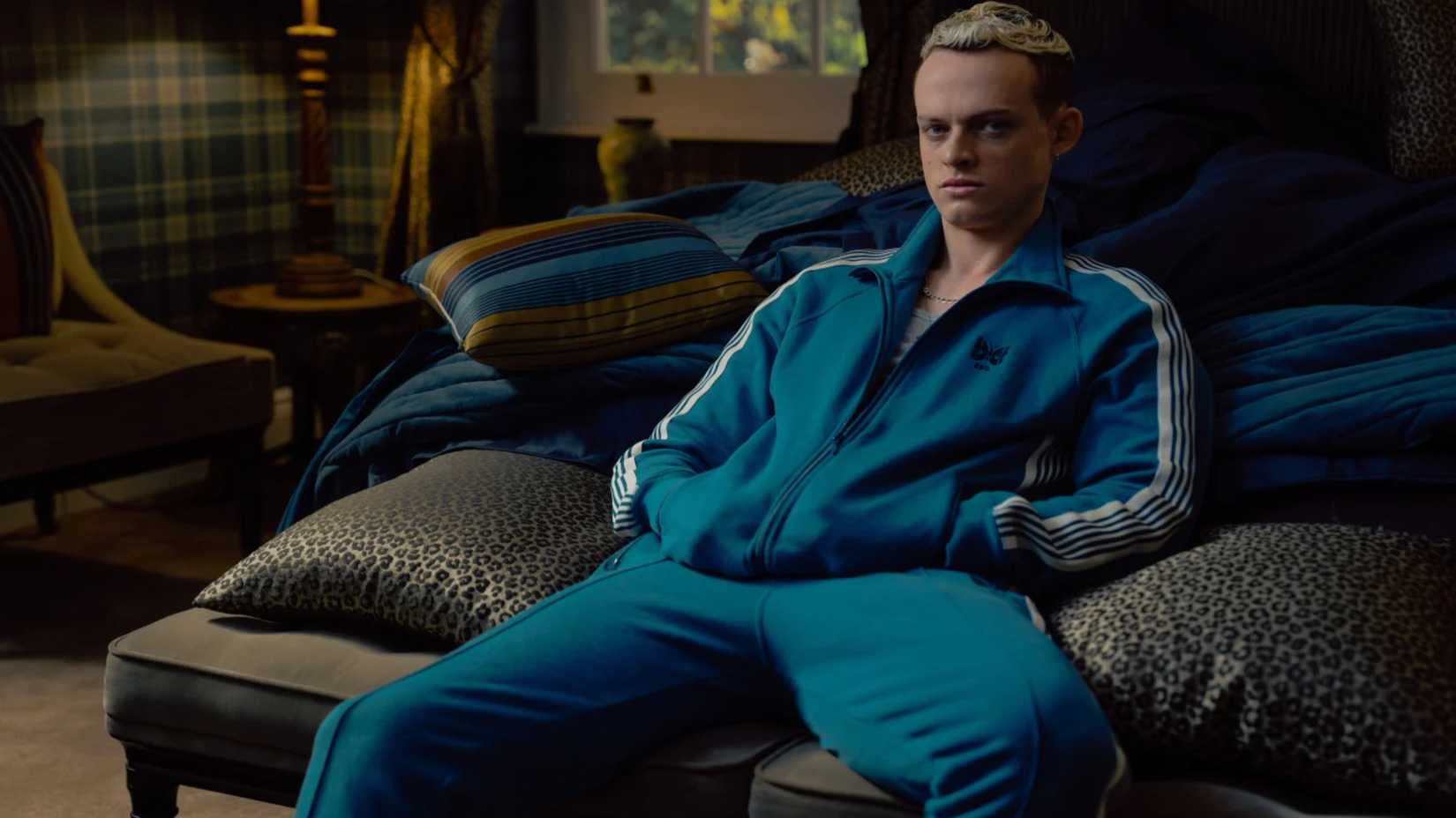 Eddie siting on a sofa, looking unbothered, in MobLand.