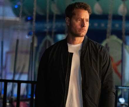 Colter standing in an amusement park, looking serious in Tracker