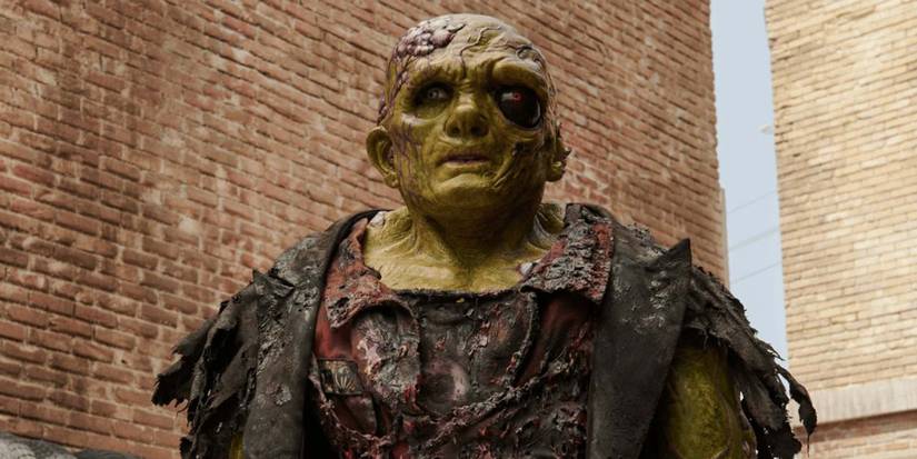 Luisa Guerreiro, in full body makeup as the titular hero, voiced by Peter Dinklage, in The Toxic Avenger.