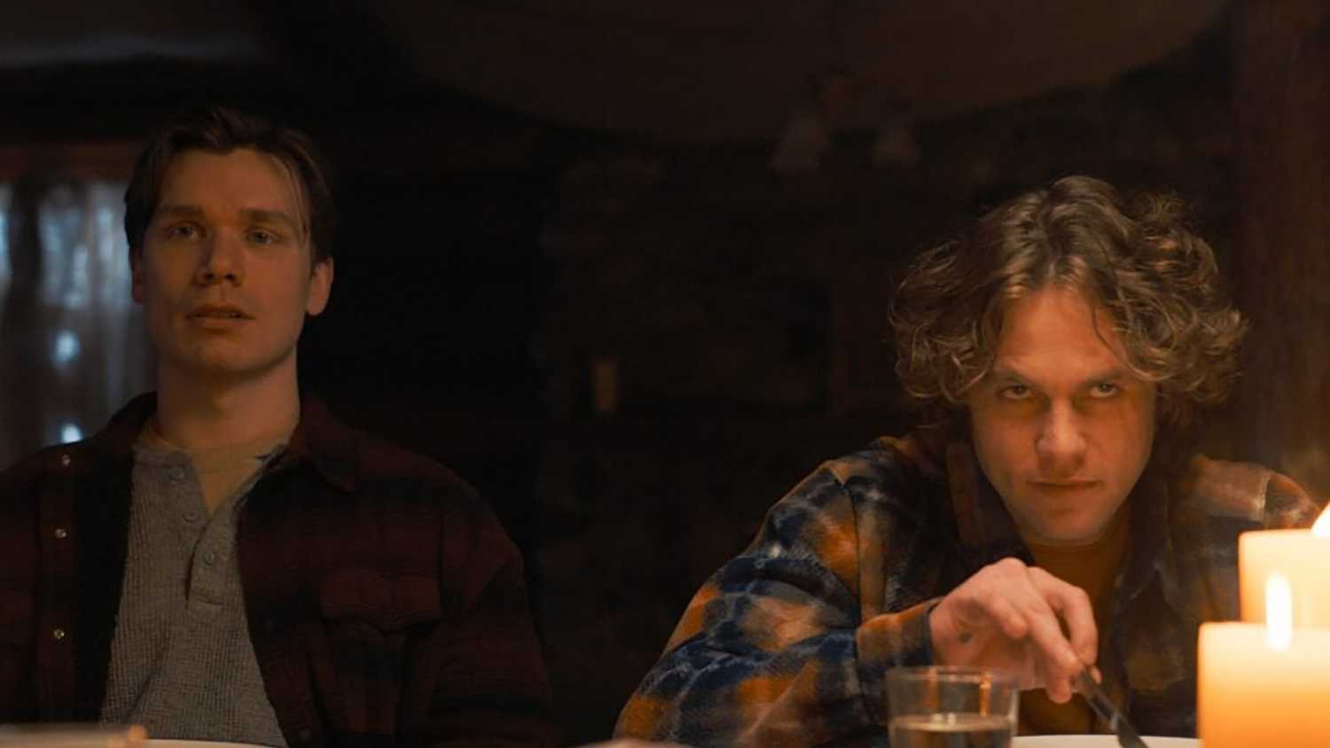 Dash and Rufus at the dinner table looking creepy in Tracker