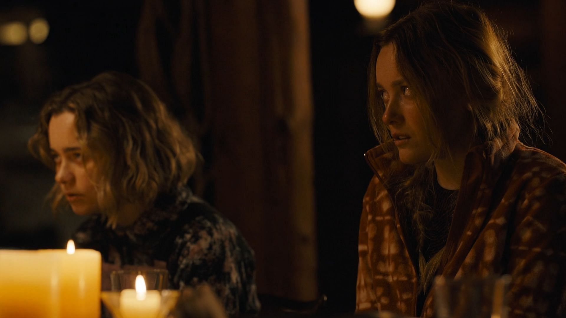 Shelly and Brianna looking scared at the dinner table in Tracker