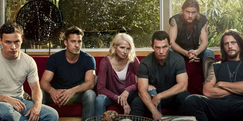 The Cody family sits on a sofa in Animal Kingdom