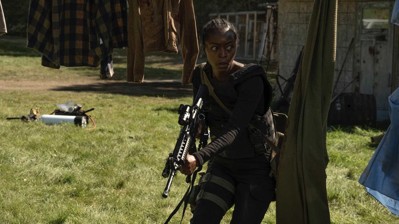 Danielle Deadwyler holds a rifle and looks intense in 40 Acres
