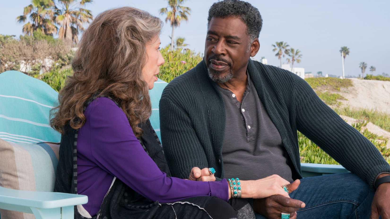 Frankie and Jacob sit in the patio in Grace and Frankie