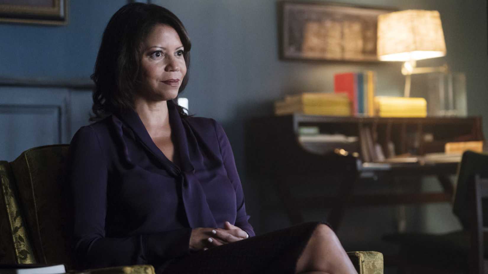 Krista sits in a recliner in Mr. Robot