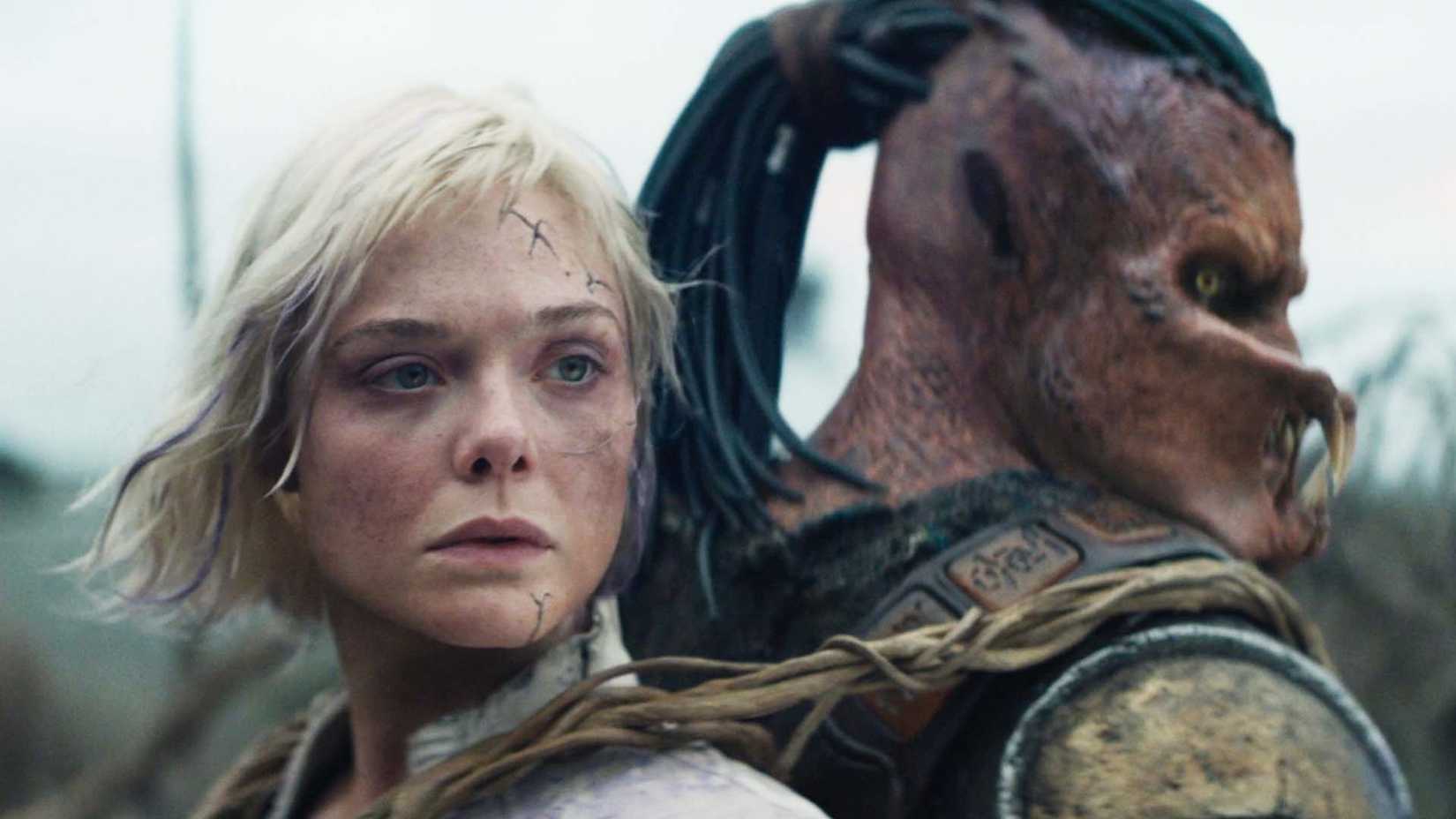 Elle Fanning as Thia and Dimitrius Schuster-Koloamatangi as Dek in Predator: Badlands