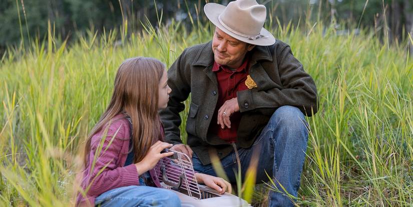 A man smiles at his daughter in Joe Pickett