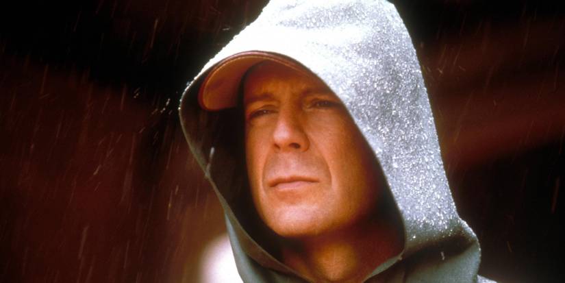 Bruce Willis as David Dunn in the rain in Unbreakable