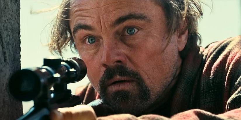 Leonardo DiCaprio's Bob Ferguson holding a rifle in One Battle After Another