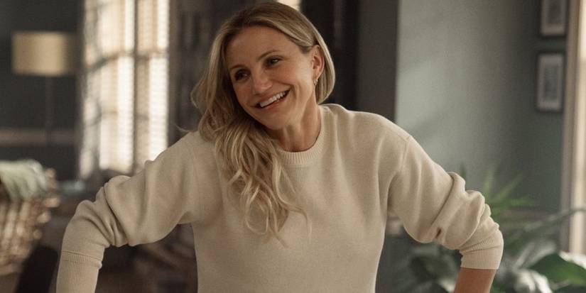 Cameron Diaz smiling in a white sweater in Back in Action