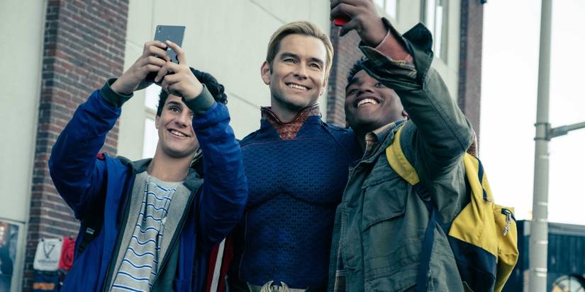 Antony Starr as Homelander posing with fans in The Boys