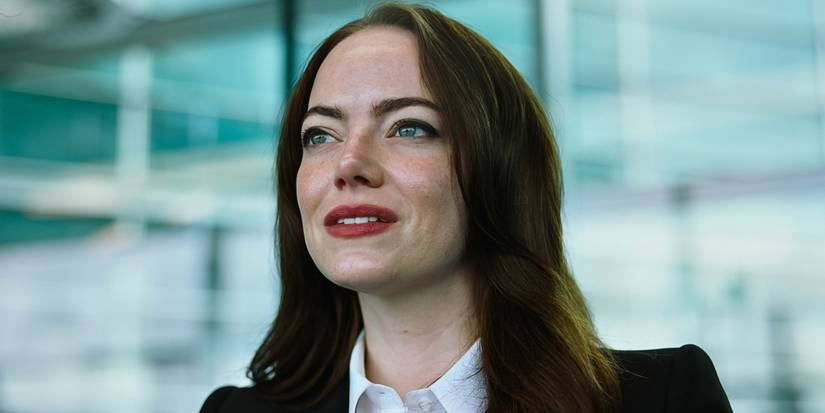 Emma Stone in Bugonia wearing a suit jacket