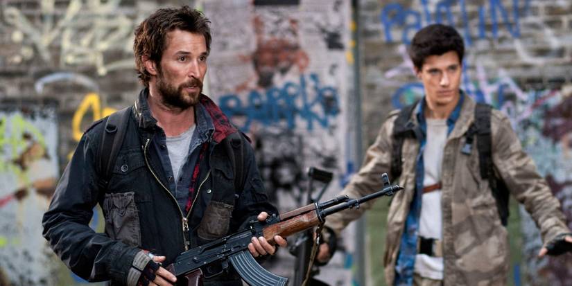 Falling Skies with Noah Wyle holding an assault rifle