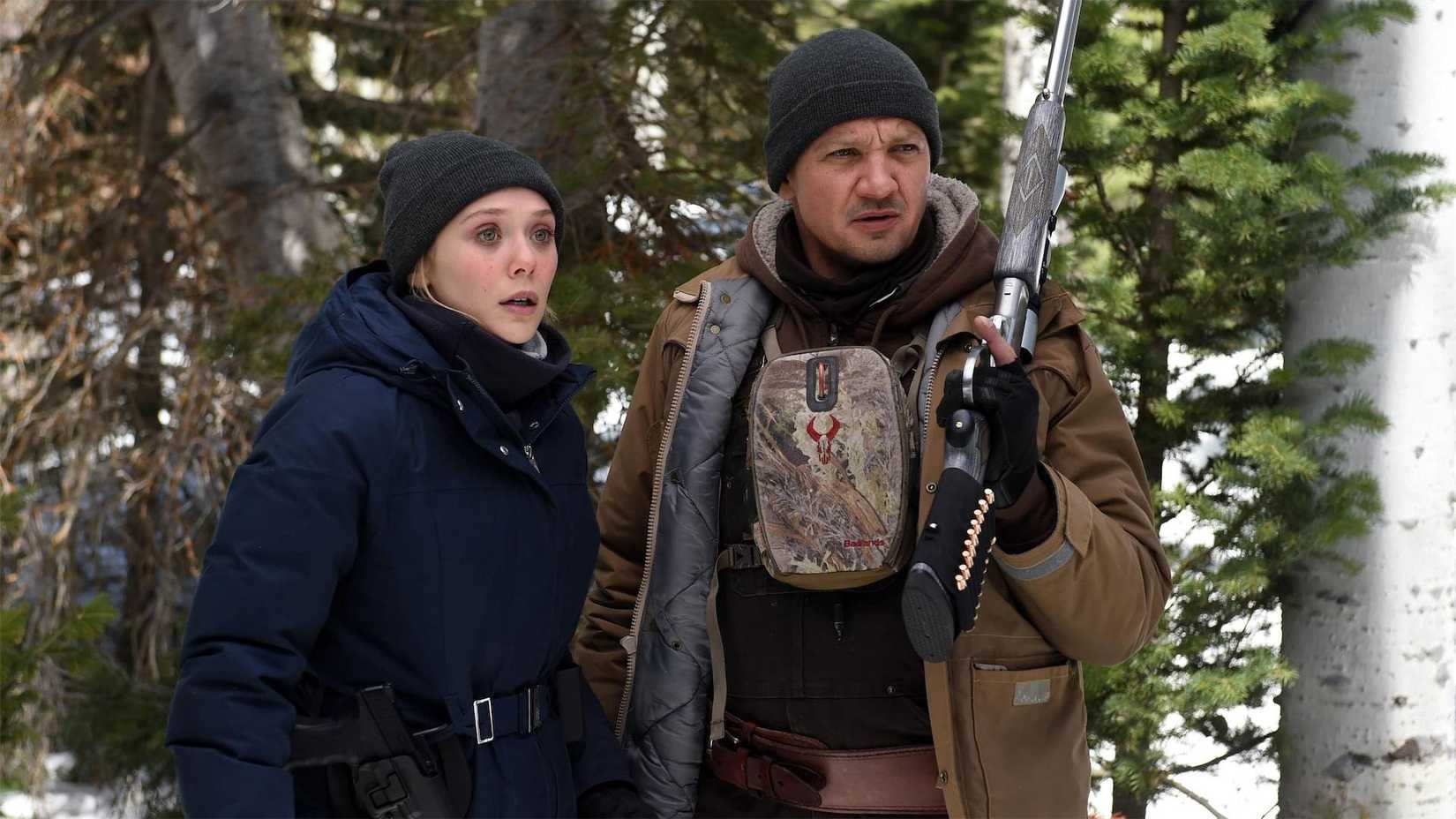 Jeremy Renner as Agent Cory Lambert and Elizabeth Olsen as Agent Jane Banner in Wind River