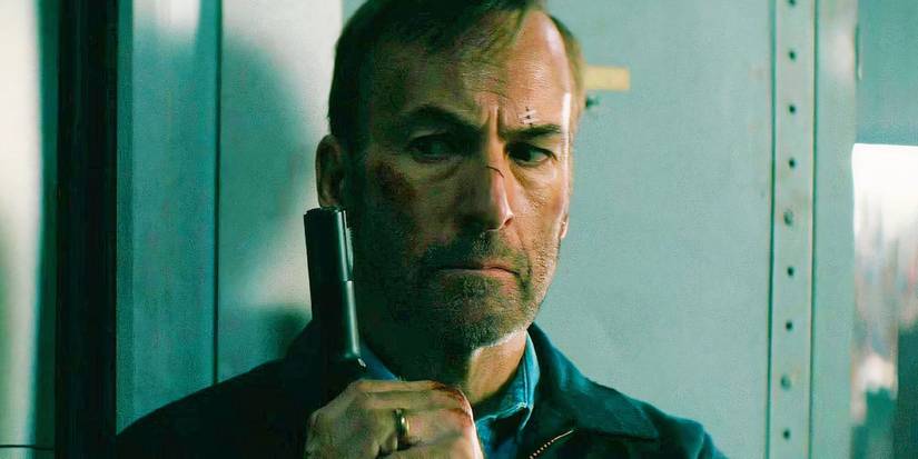 Bob Odenkirk holding a gun in Nobody